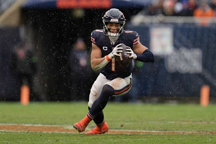 Dec 31, 2023; Chicago, Illinois, USA; Chicago Bears quarterback Justin Fields (1) runs with the ball against the Atlanta Falcons at Soldier Field.